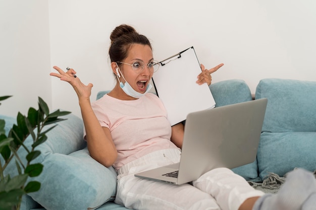 Adult woman casually working from home