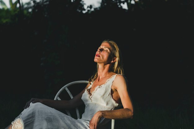 Adult woman enjoying sun