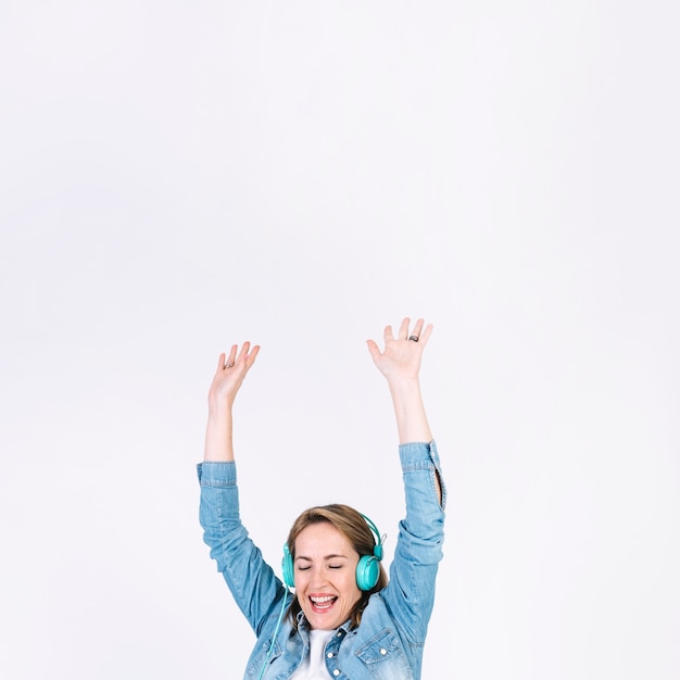 Adult woman listening to music and dancing