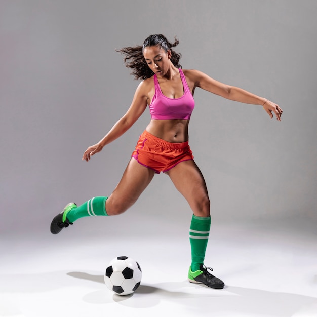 Adult woman playing football