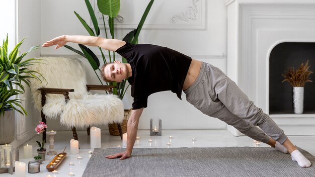 Adult woman practicing yoga at home