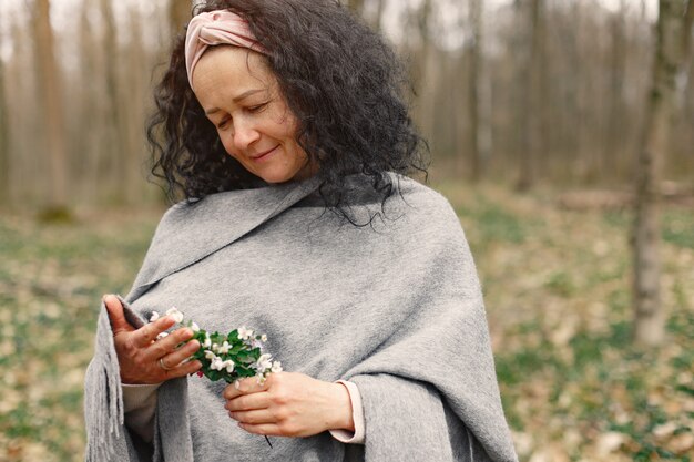 Adult woman in a spring forest