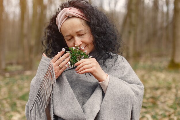 Adult woman in a spring forest