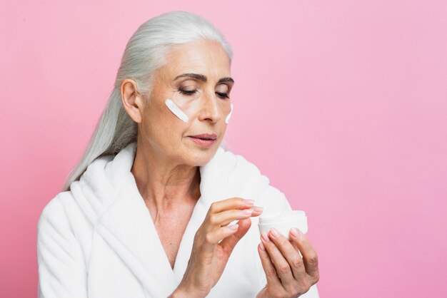 Adult woman testing moisture cream