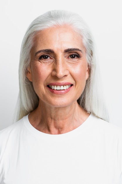 Adult woman with gray hair smiling