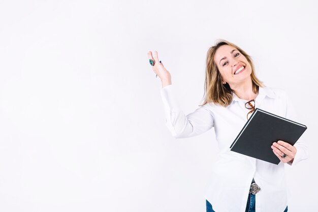 Adult woman with notebook smiling