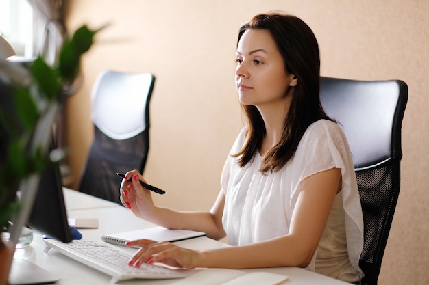 Adult woman working at office