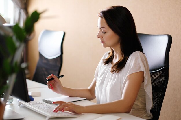 Adult woman working at office