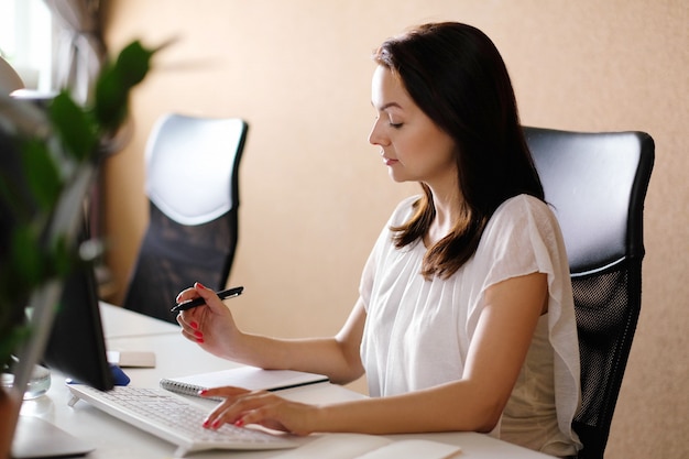 Adult woman working at office