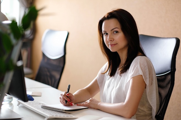Adult woman working at office