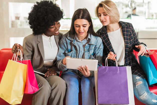 Adult women checking their shopping bags