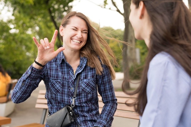 Adult women communicating through sign language