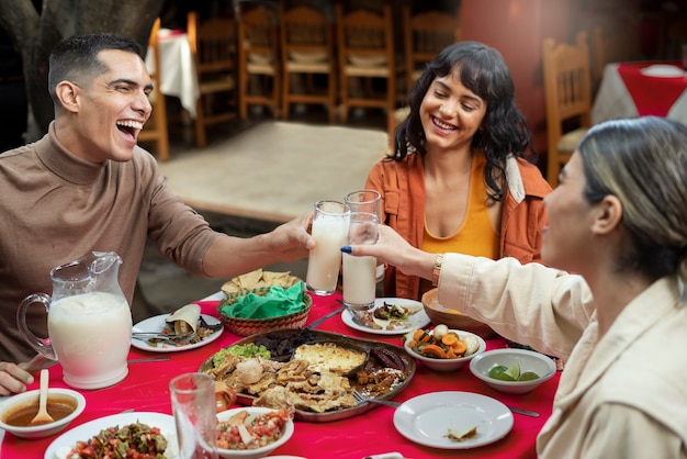 Adults enjoying mexican food