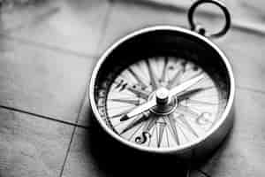 Free photo adventure desktop wallpaper background, compass on map in black and white tone