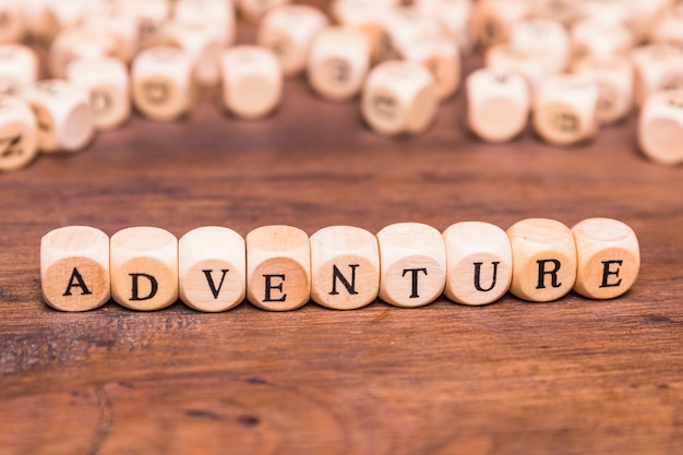 Adventure text arranged with wooden cubes