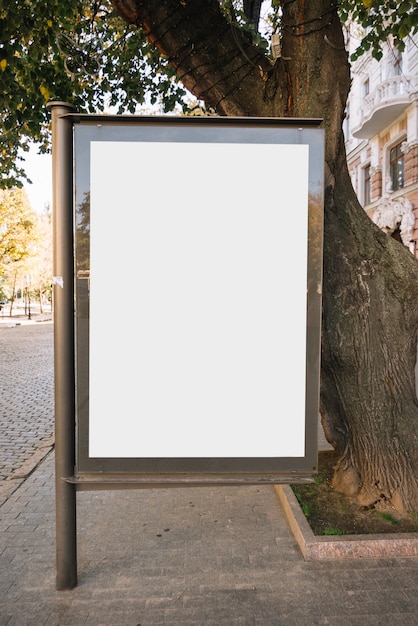 Free photo advertising panel near tree