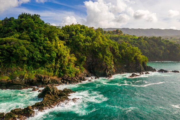 Aerial beautiful shot of an island seashore with a sea on the side