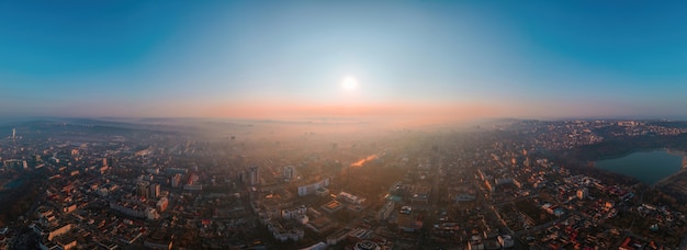 Aerial drone panorama view of Chisinau, Moldova at sunrise.