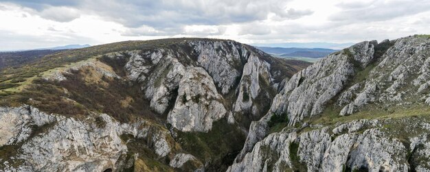 Aerial drone panoramic view of a rocky canyon in Romania