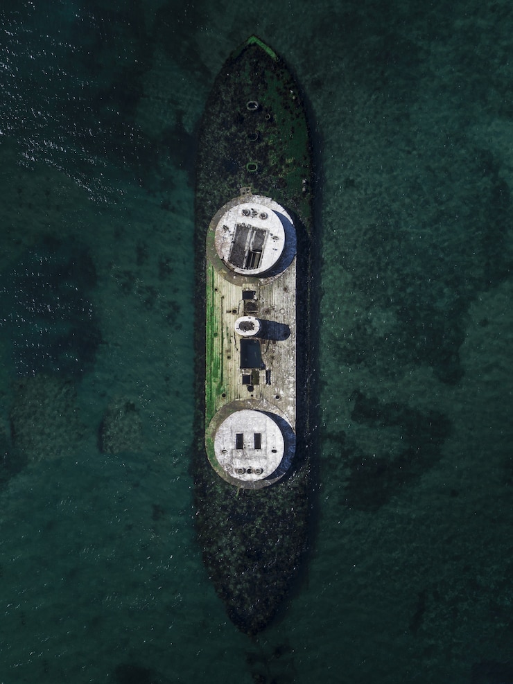 Free Photo aerial drone shot of a wrecked ship in the sea