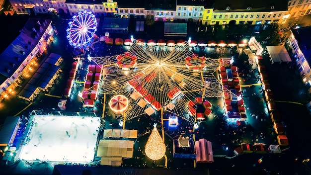 Aerial drone view of The Big Square in Sibiu at night Romania Old city centre decorated