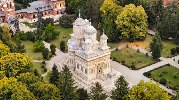 Aerial drone view of The Cathedral of Curtea de Arges Romania Episcopal Church square