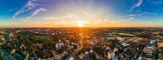 Aerial drone view of Chisinau downtown Panorama view of multiple buildings roads Park with lush