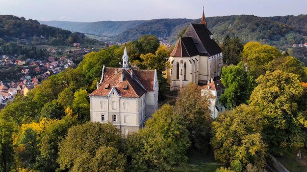 Aerial drone view of the Historic Centre of Sighisoara Romania Church on the Hill