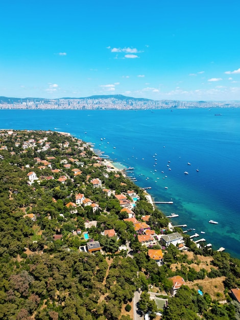 Aerial drone view of Kinaliada Turkey Residential buildings located on the shore of Marmara sea Istanbul in the distance