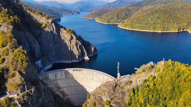 Aerial drone view of nature in Romania Valley in Carpathian mountains with Vidraru dam and lake