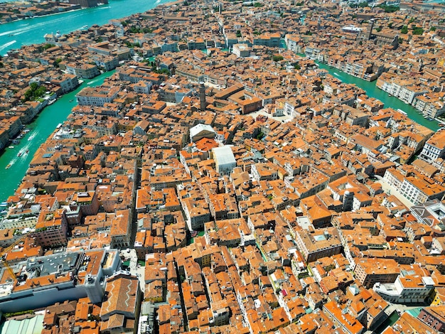 Aerial drone view of Venice Italy Water channels with multiple floating and moored boats