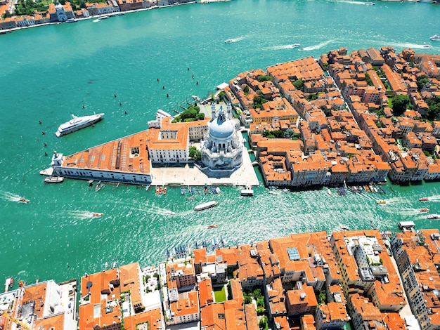 Free photo aerial drone view of venice italy water channels with multiple floating and moored boats