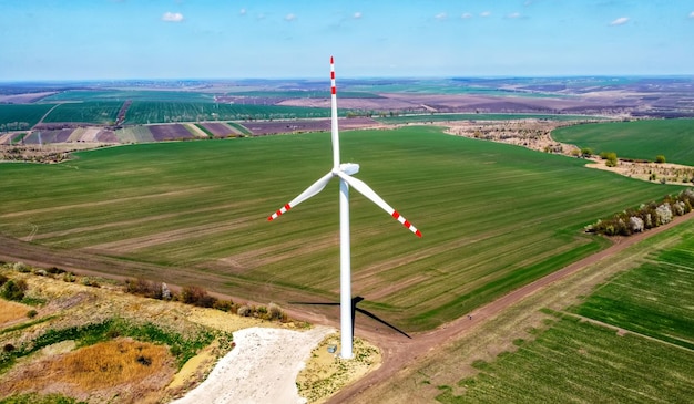 Free photo aerial drone view of wind turbine in moldova