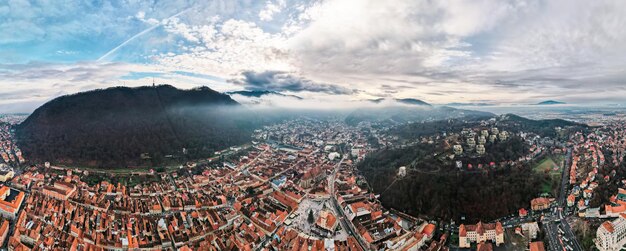 Aerial drone wide view of Brasov in winter Romania