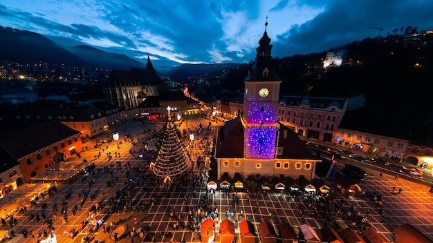 Aerial drone wide view of The Council Square decorated for Christmas in Brasov Romania