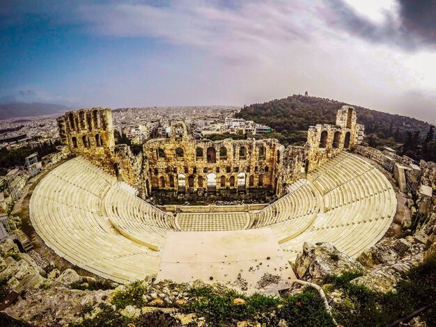 Aerial shot of a beautiful cityscape with a historic architectural structure in Greece