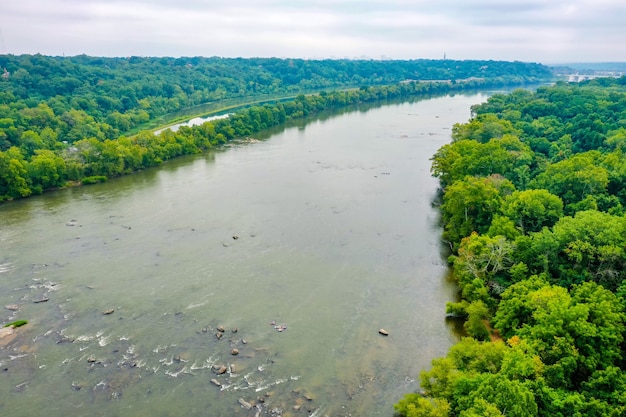 Aerial shot of a beautiful James River in Virginia, USA with a cloudy sky