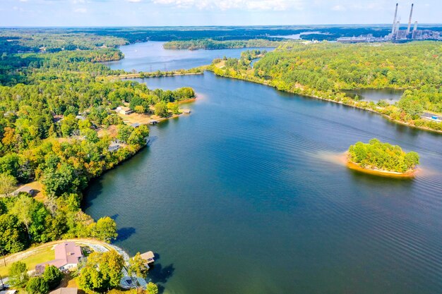 Aerial shot of Belews Lake in North Carolina, USA with a small island, houses, powerplant
