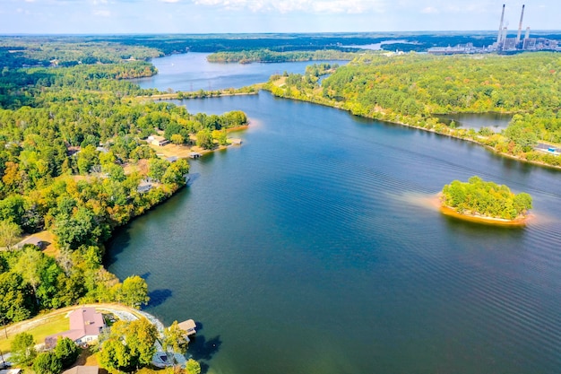 Aerial shot of Belews Lake in North Carolina, USA with a small island, houses, powerplant