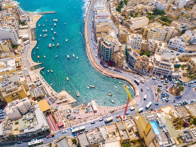 Aerial shot of the buildings and houses by the bay