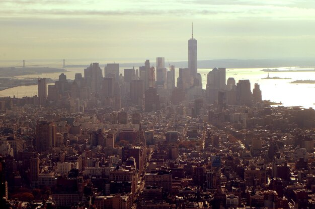 Aerial shot of city buildings under a cloudy sky