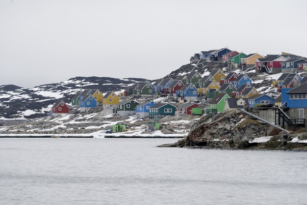 Aerial shot of colorful houses in Aasiaat city, Greenland