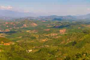 Free photo aerial shot of forested mountains in dalat