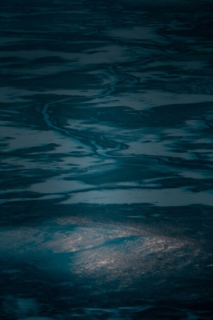 Aerial shot of a landscape covered with snow at dawn