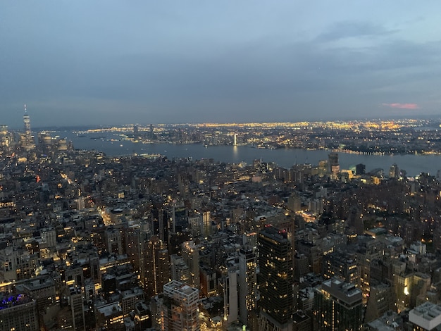 Free photo aerial shot of a megapolis with illuminated high buildings