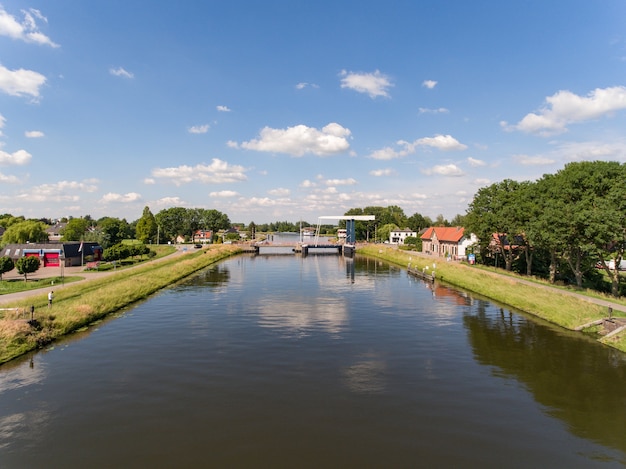 Aerial shot of the Merwede canal near the Arkel village located in the Netherlands
