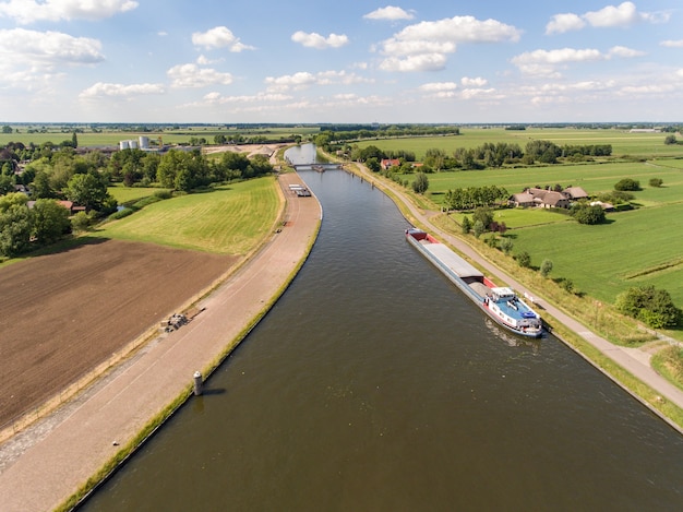 Aerial shot of the Merwede canal near the Arkel village located in the Netherlands