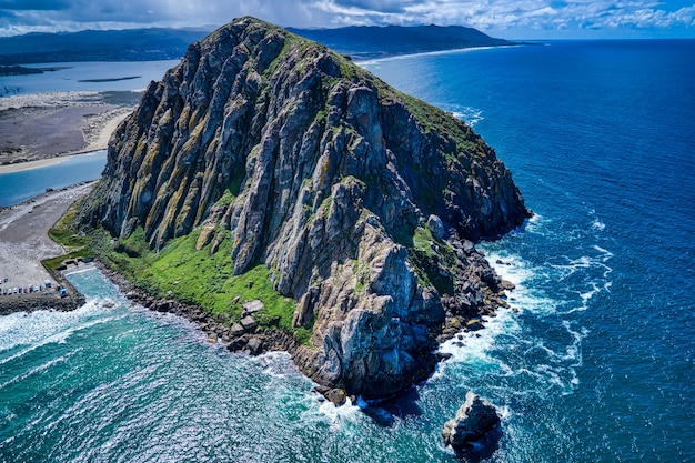 Aerial shot of the Morro Rock in California at midday