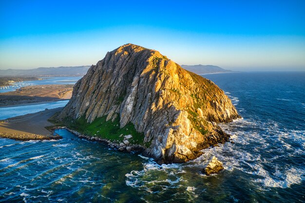 Aerial shot of the Morro Rock in California at midday