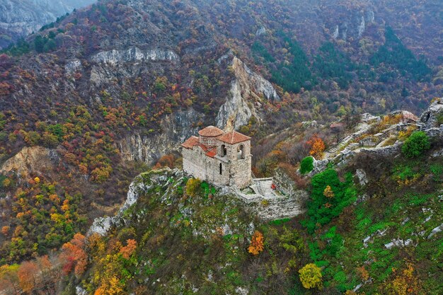 Aerial shot of an old building on top of a cliff